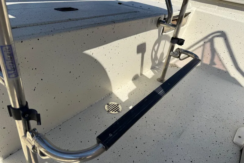 Slide: The Image of 2018 Xpress H20B Bay boat interior with stainless steel ladder and non-slip flooring. - 73