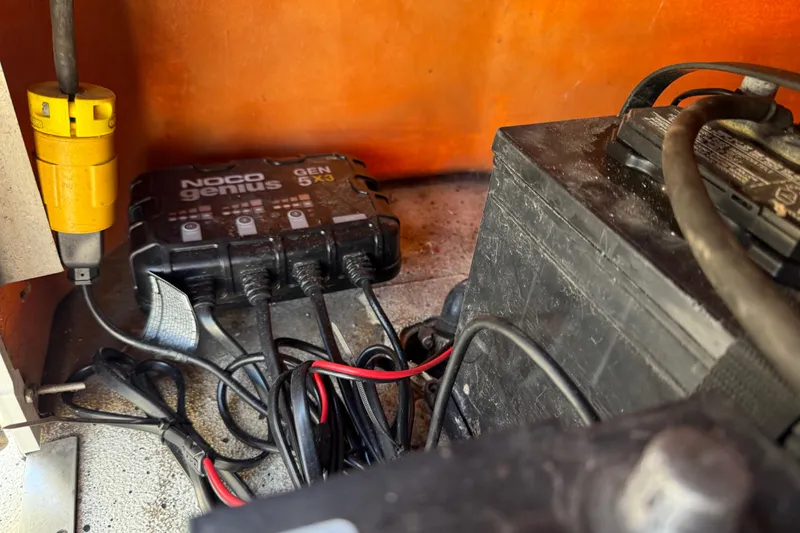 Slide: The Image of NOCO Genius GEN5X3 charger and battery setup in 2018 Xpress H20B Bay boat. - 74