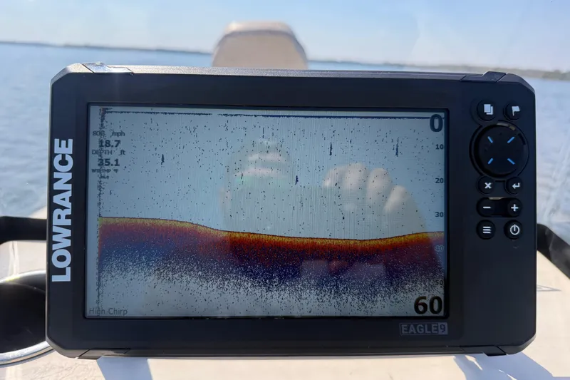 Slide: The Image of Fishfinder display on 2018 Xpress H20B Bay boat, showing depth and sonar data. - 79