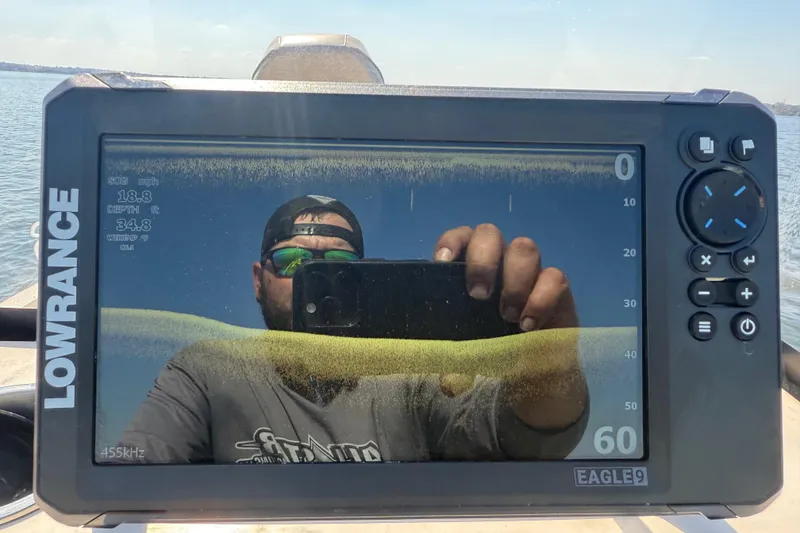 Slide: The Image of Reflection on Lowrance fishfinder screen aboard 2018 Xpress H20B Bay boat. - 80