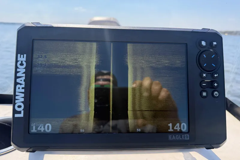 Slide: The Image of Lowrance fish finder display on 2018 Xpress H20B Bay boat, showing sonar data. - 81