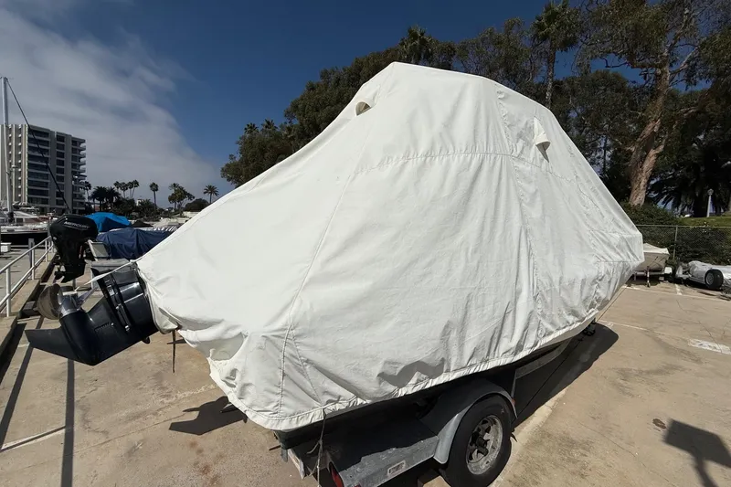 Slide: The Image of 2019 Boston Whaler 190 Montauk swim platform with ladder, docked at marina. - 12