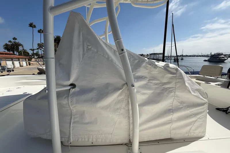 Slide: The Image of Covered 2019 Boston Whaler 190 Montauk boat on trailer at marina. - 16