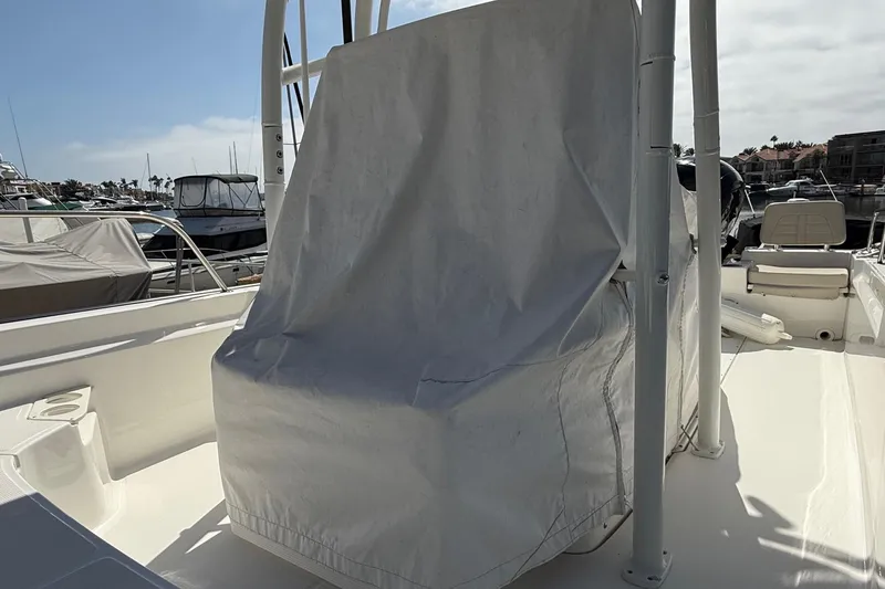 Slide: The Image of Covered 2019 Boston Whaler 190 Montauk boat on trailer at marina. - 18