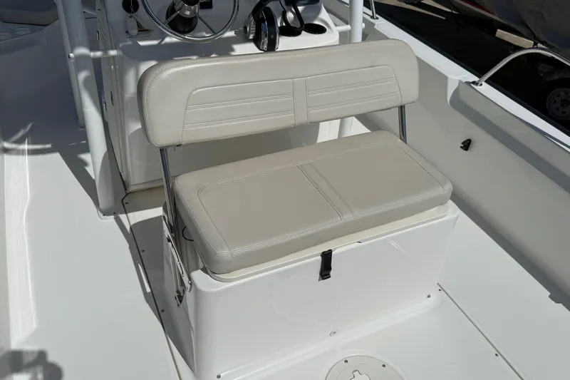 Slide: The Image of 2019 Boston Whaler 190 Montauk boat with protective cover, docked by the marina. - 22