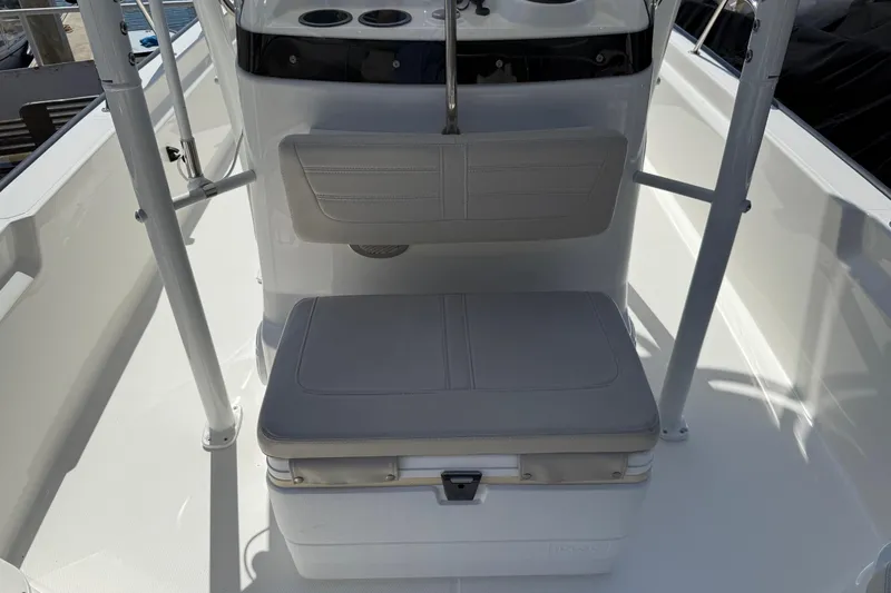 Slide: The Image of 2019 Boston Whaler 190 Montauk boat seat with beige upholstery and storage underneath. - 29