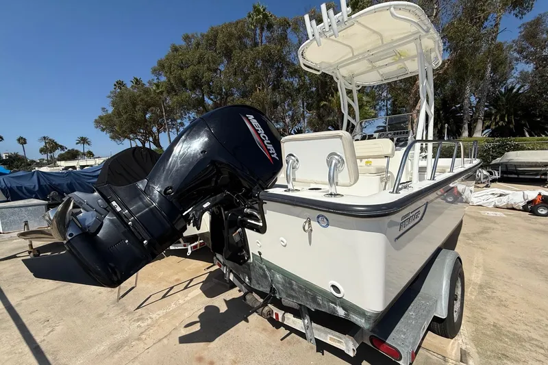 Slide: The Image of 2019 Boston Whaler 190 Montauk boat docked in a marina. - 3