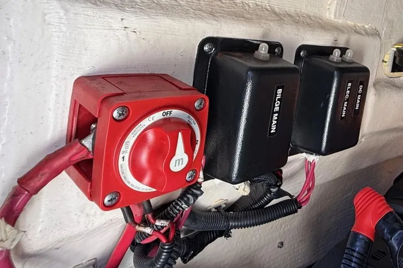 Slide: The Image of Electrical switches and wiring inside a 2019 Boston Whaler 190 Montauk boat. - 34