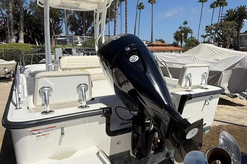 Slide: The Image of 2019 Boston Whaler 190 Montauk boat docked by the waterfront. - 4