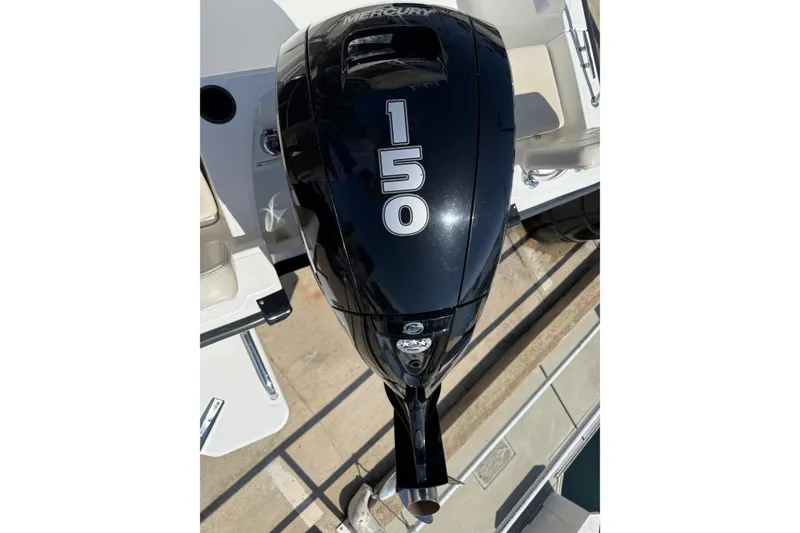 Slide: The Image of 2019 Boston Whaler 190 Montauk boat docked in a marina. - 5