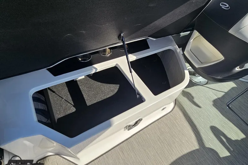Slide: The Image of 2018 Regal 2500 Bowrider interior storage compartment with cup holders and seating. - 100