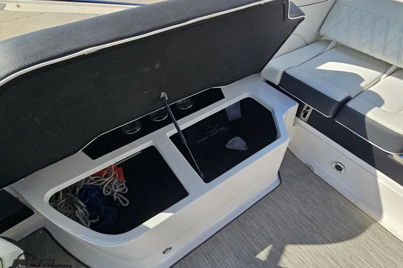 Slide: The Image of 2018 Regal 2500 Bowrider boat storage compartment with ropes and seating area. - 102