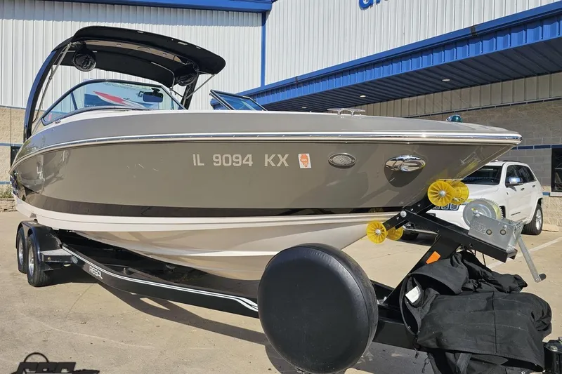 Slide: The Image of 2018 Regal 2500 Bowrider boat on trailer outside dealership. - 15