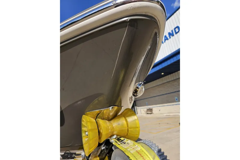 Slide: The Image of 2018 Regal 2500 Bowrider boat bow with yellow strap, outdoor setting. - 16