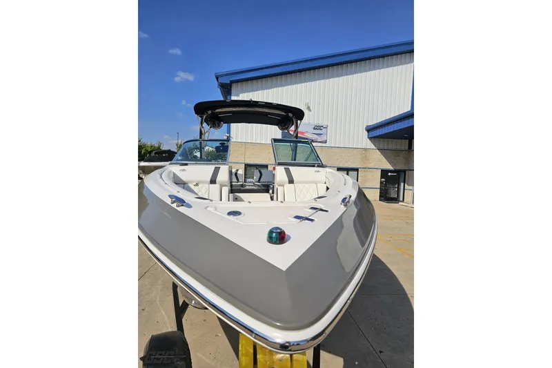 Slide: The Image of 2018 Regal 2500 Bowrider boat displayed outdoors, showcasing sleek design and spacious seating. - 17