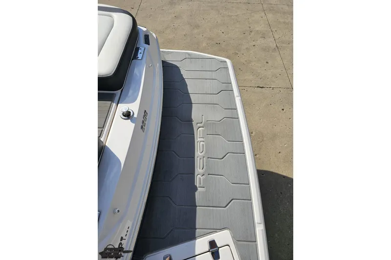 Slide: The Image of 2018 Regal 2500 Bowrider boat with sleek deck design and branding. - 34