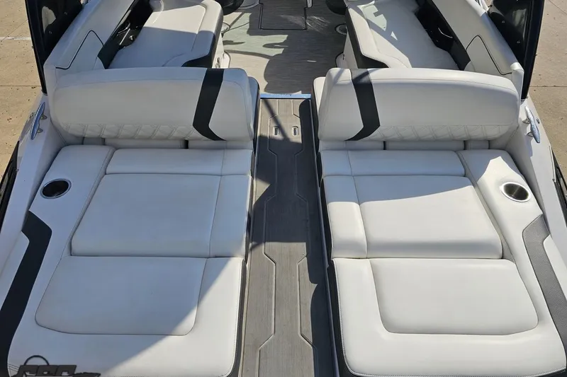 Slide: The Image of 2018 Regal 2500 Bowrider interior with white cushioned seating and cup holders. - 37