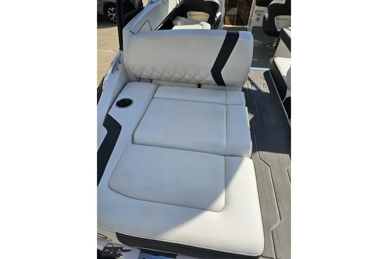 Slide: The Image of 2018 Regal 2500 Bowrider interior with white cushioned seating and cup holder. - 39