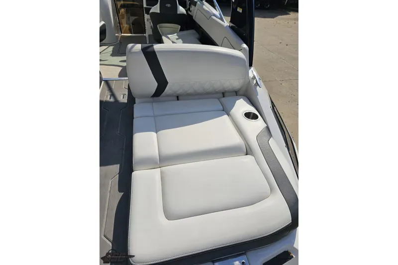 Slide: The Image of 2018 Regal 2500 Bowrider boat interior with white cushioned seating and cup holder. - 40