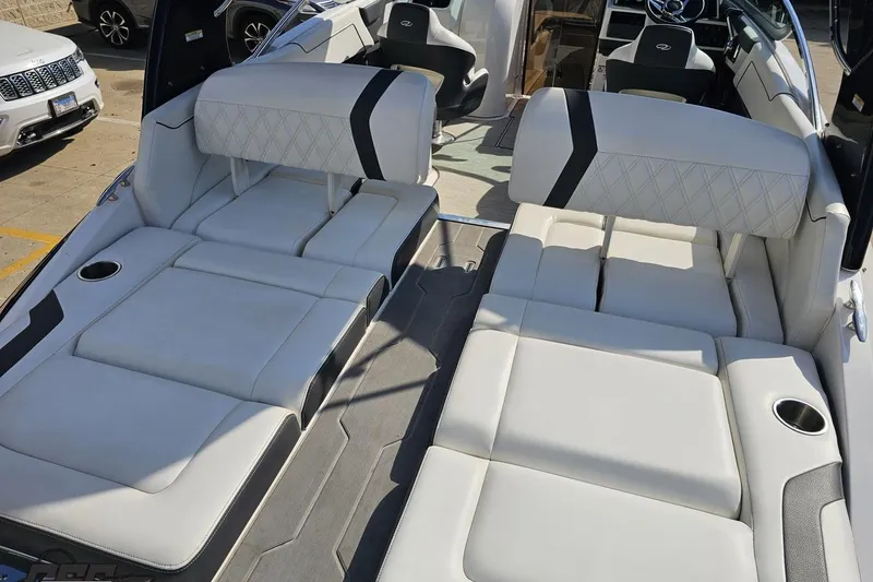Slide: The Image of 2018 Regal 2500 Bowrider interior with luxurious white seating and cup holders. - 41