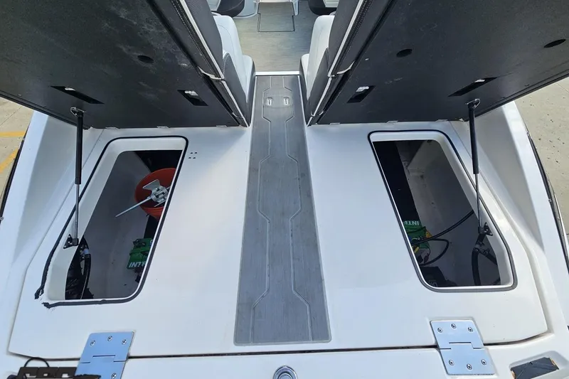 Slide: The Image of 2018 Regal 2500 Bowrider storage compartments open, showcasing interior space. - 43