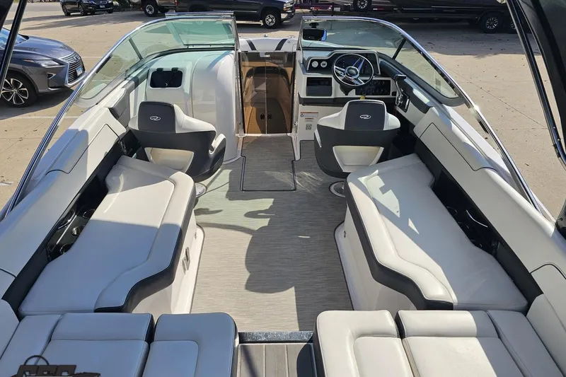 Slide: The Image of 2018 Regal 2500 Bowrider interior with white seating and modern dashboard. - 50