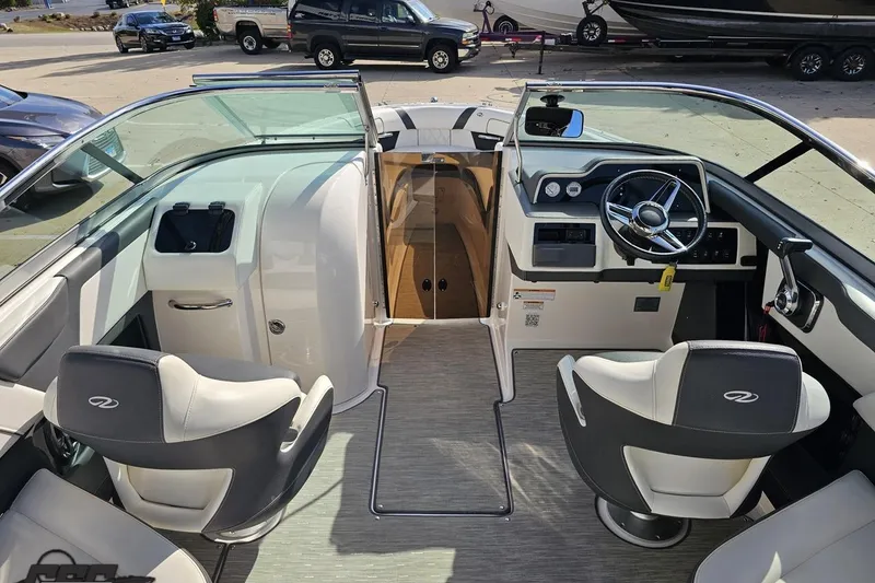 Slide: The Image of 2018 Regal 2500 Bowrider interior with dual helm seats and modern dashboard controls. - 51