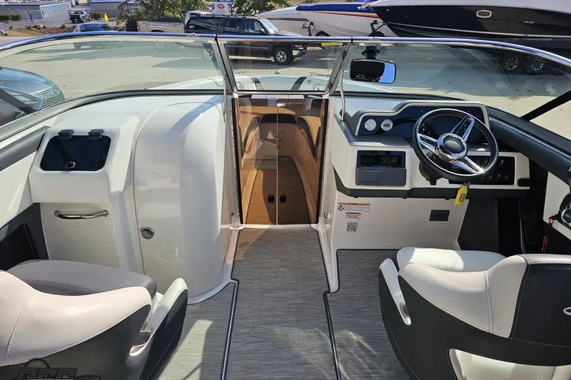 Slide: The Image of 2018 Regal 2500 Bowrider interior with steering wheel, seating, and dashboard controls. - 59
