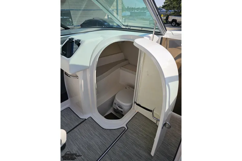Slide: The Image of 2018 Regal 2500 Bowrider boat interior with compact bathroom and toilet. - 63