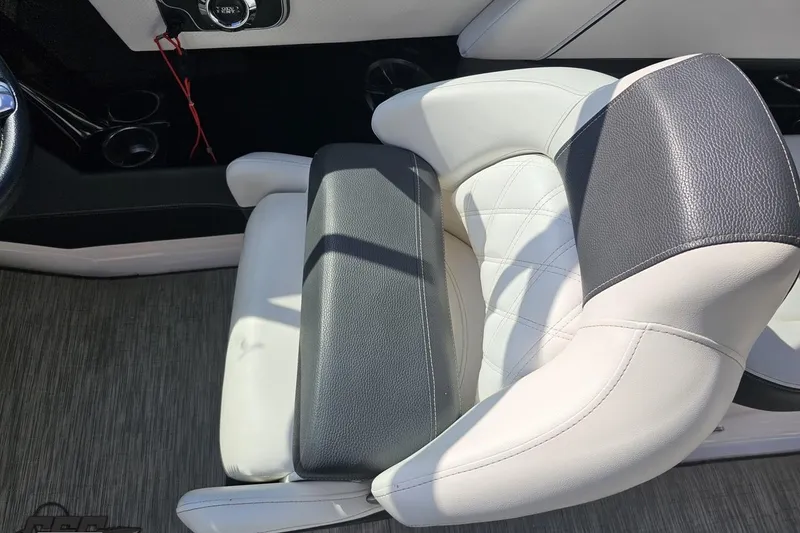 Slide: The Image of 2018 Regal 2500 Bowrider boat seat with white and black upholstery. - 66