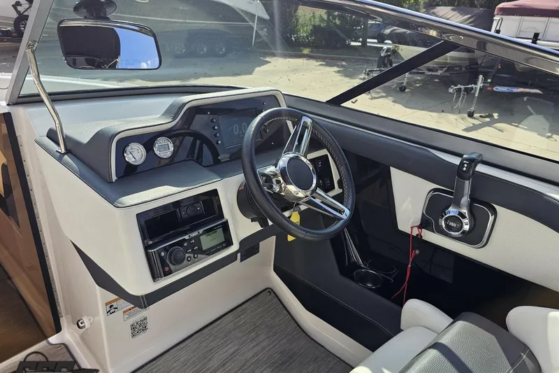 Slide: The Image of 2018 Regal 2500 Bowrider dashboard with steering wheel and control panel. - 67