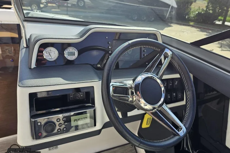 Slide: The Image of 2018 Regal 2500 Bowrider dashboard with steering wheel and control panel. - 68