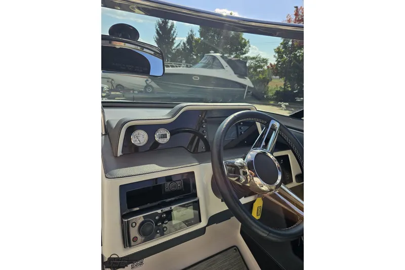 Slide: The Image of 2018 Regal 2500 Bowrider dashboard with steering wheel and control panel. - 70