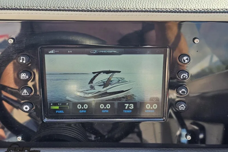 Slide: The Image of Dashboard display of a 2018 Regal 2500 Bowrider boat with control buttons. - 71