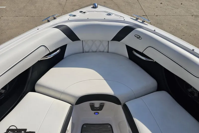 Slide: The Image of 2018 Regal 2500 Bowrider boat interior with white cushioned seating and sleek design. - 78