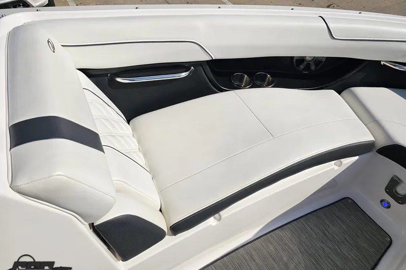 Slide: The Image of Luxurious seating in a 2018 Regal 2500 Bowrider boat, featuring sleek white upholstery. - 80