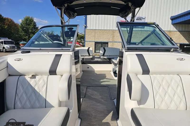 Slide: The Image of 2018 Regal 2500 Bowrider boat interior with white leather seating and open cockpit. - 81
