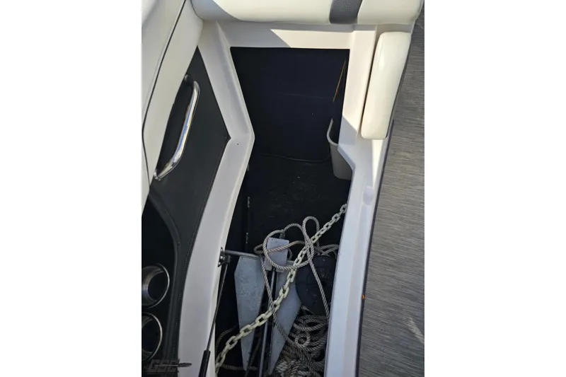 Slide: The Image of 2018 Regal 2500 Bowrider boat storage compartment with anchor and ropes. - 87