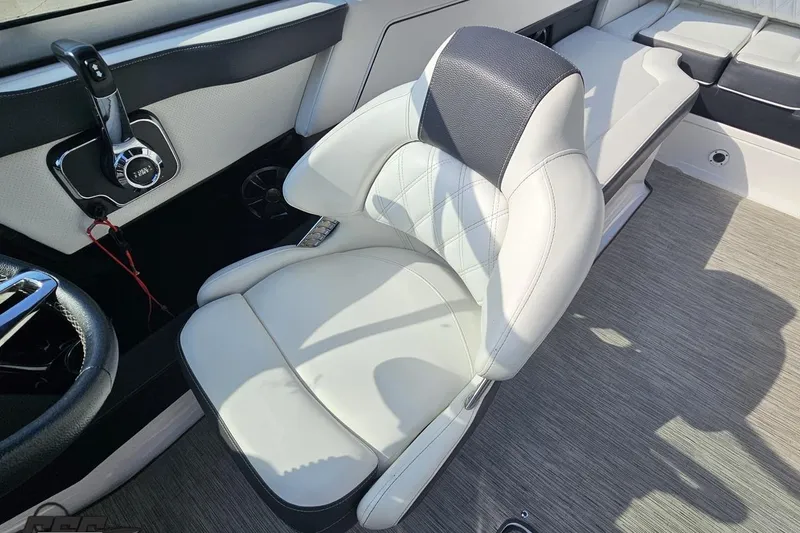 Slide: The Image of 2018 Regal 2500 Bowrider interior with luxurious white seating and modern controls. - 90