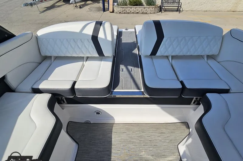 Slide: The Image of 2018 Regal 2500 Bowrider interior with white leather seating and black accents. - 93