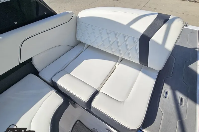 Slide: The Image of 2018 Regal 2500 Bowrider boat interior with white cushioned seating and diamond stitching. - 96