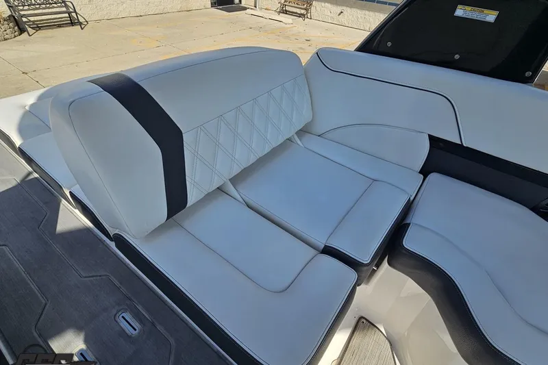 Slide: The Image of Luxurious seating on 2018 Regal 2500 Bowrider boat, featuring elegant white upholstery. - 97