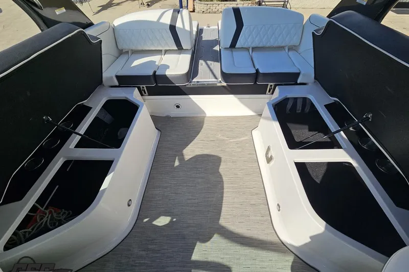 Slide: The Image of 2018 Regal 2500 Bowrider interior with spacious seating and storage compartments. - 99