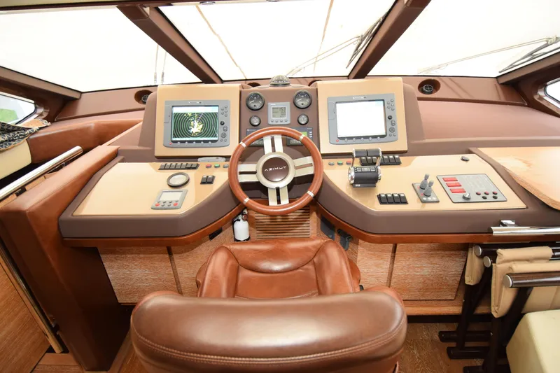 Slide: The Image of Luxurious helm of 2010 Azimut 58 yacht with advanced navigation controls. - 1