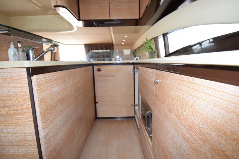 Slide: The Image of Luxurious kitchen interior of 2010 Azimut 58 yacht with modern wood cabinetry. - 10