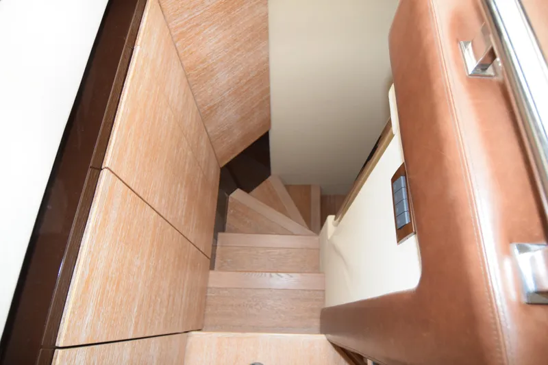 Slide: The Image of Interior staircase of 2010 Azimut 58 yacht with wooden steps and leather accents. - 11