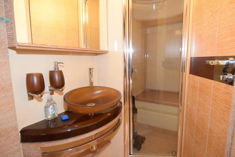 Slide: The Image of Luxurious bathroom in 2010 Azimut 58 yacht with modern fixtures and glass shower. - 14