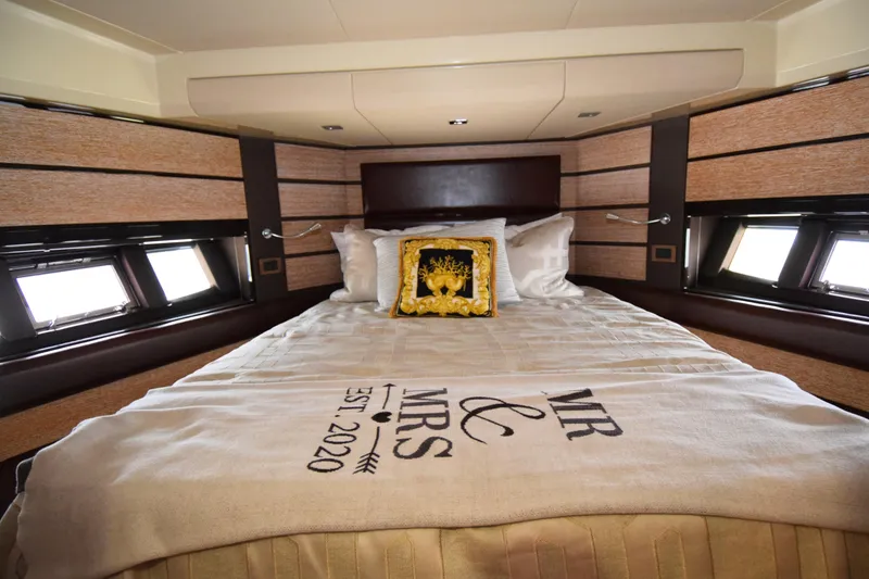 Slide: The Image of Luxurious bedroom interior of 2010 Azimut 58 yacht with elegant bedding and decor. - 19