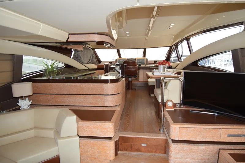Slide: The Image of Luxurious interior of a 2010 Azimut 58 yacht with elegant wood and leather finishes. - 2