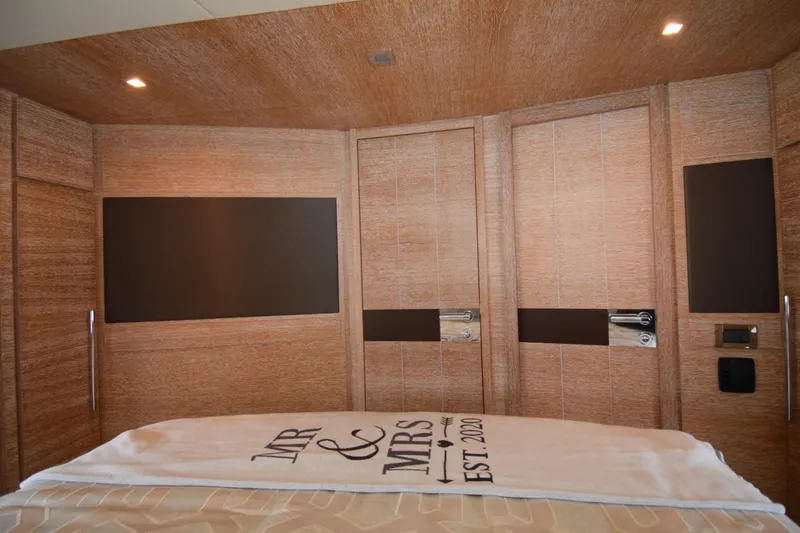 Slide: The Image of Luxurious interior of 2010 Azimut 58 yacht with elegant wood paneling and custom towel. - 21